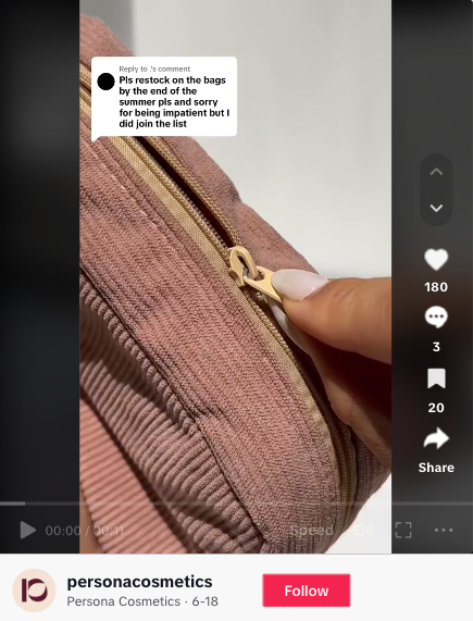 Snimak zaslona TikTok videa Persona Cosmetics kao odgovor korisniku's comment asking "Pls restock on the bags by the end of the summer pls" and the video shows a hand unzipping a blush pink makeup bag.