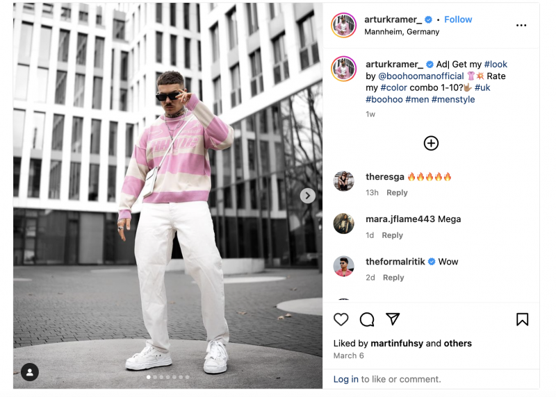   Una publicación de Instagram de Arthur Kramer vistiendo un traje rosa y blanco para su patrocinio de Boohoo Man.